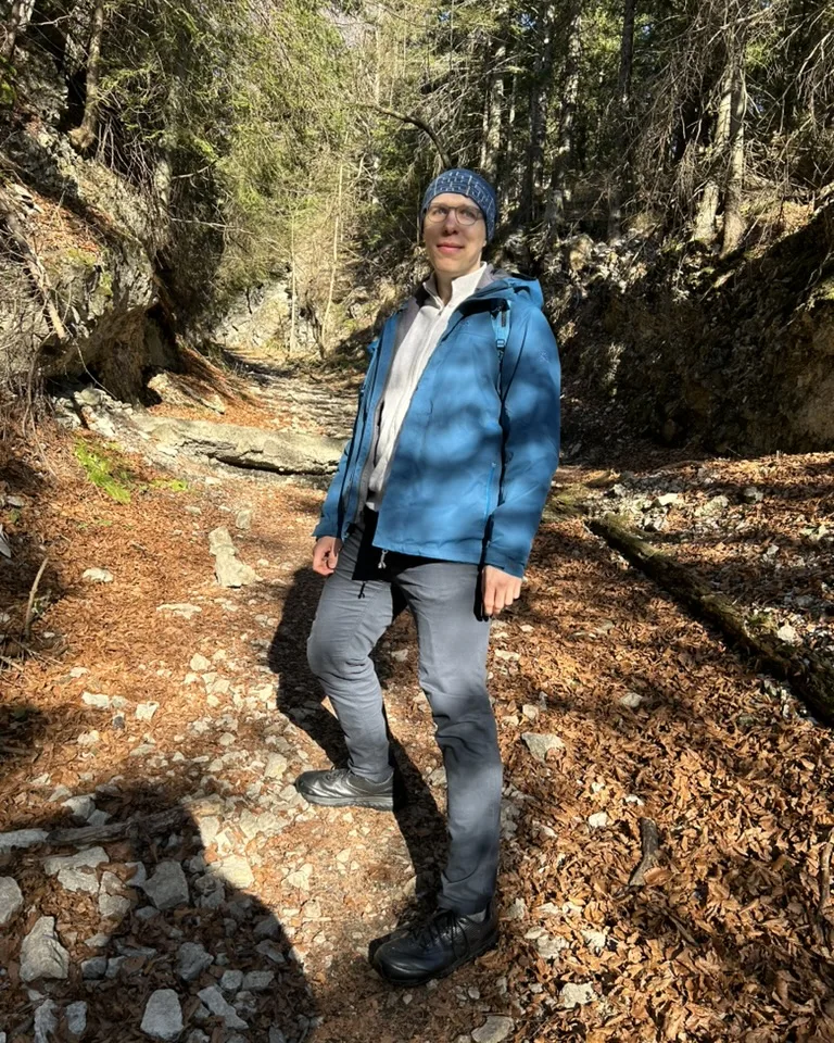 Paul Simmering hiking in the woods