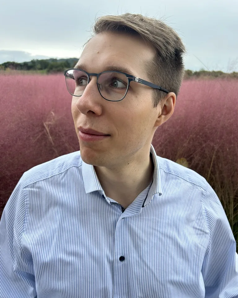 Paul Simmering in a field of pink grass
